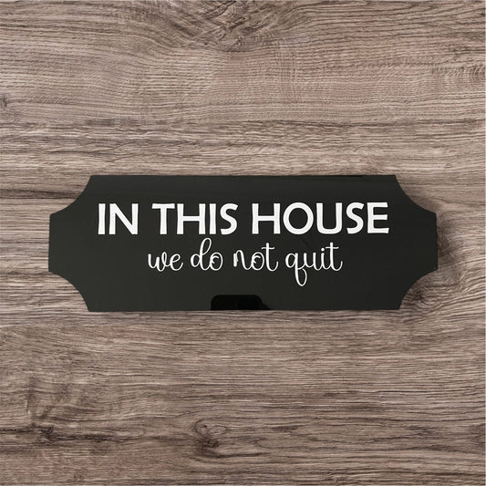 Acrylic sign in this house we do not quit