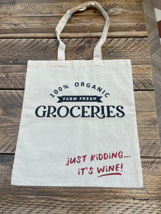 Tote bag 100% organic groceries just kidding it’s wine