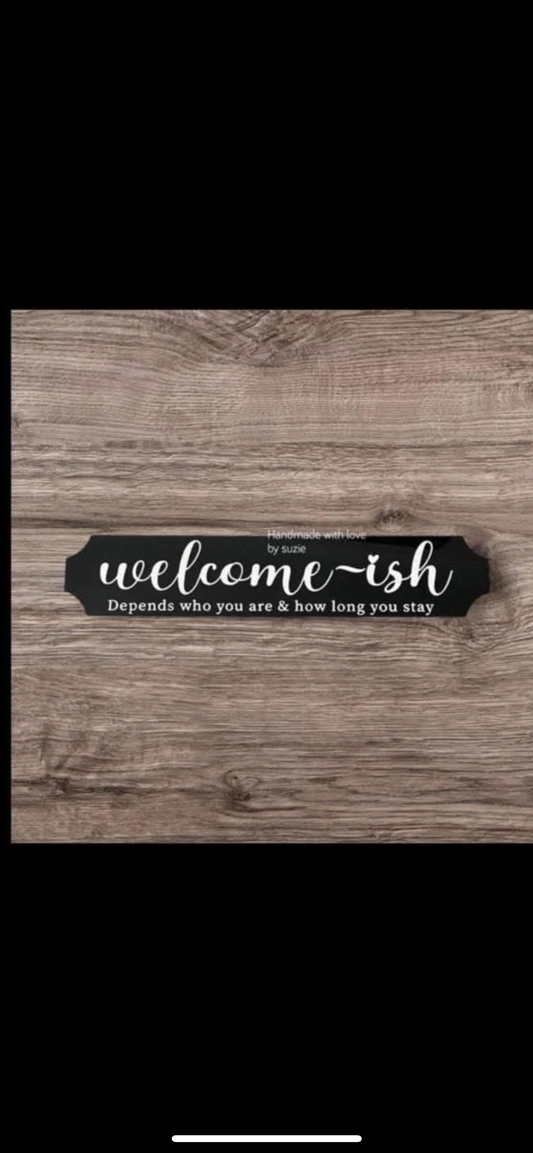 Acrylic black sign welcome-ish depends who you are