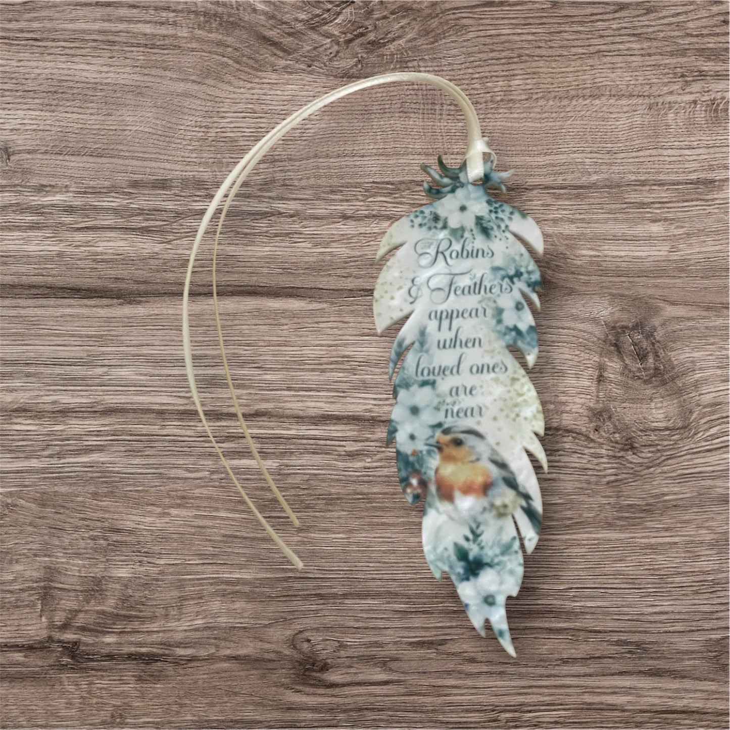Acrylic white swirl feather when robins are near